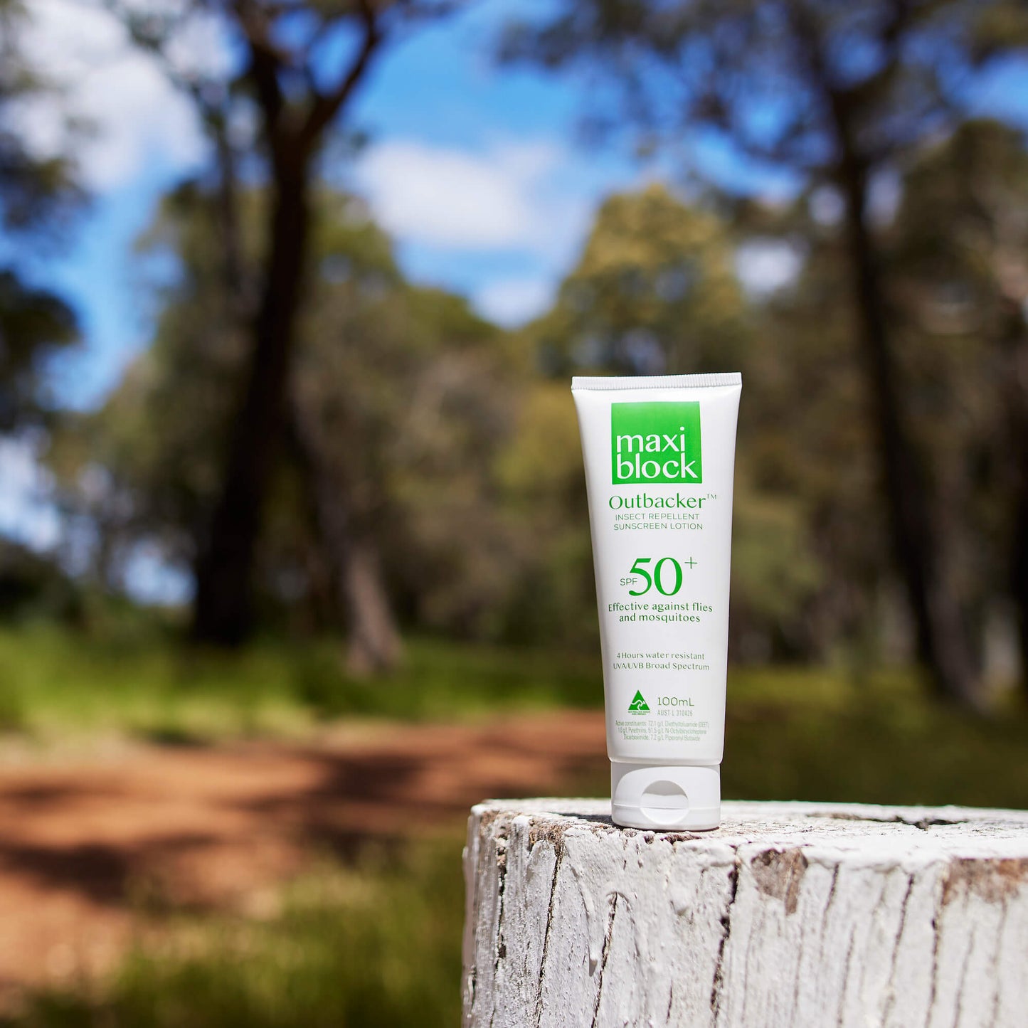 Maxiblock Outbacker Sunscreen with insect repellent tube SPF 50+ sitting on fence pole