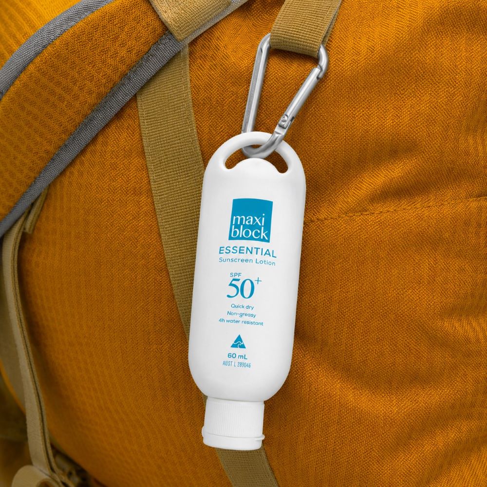Maxiblock Essential Everyday Sunscreen SPF 50+ Attached To Yellow Hiking Bag