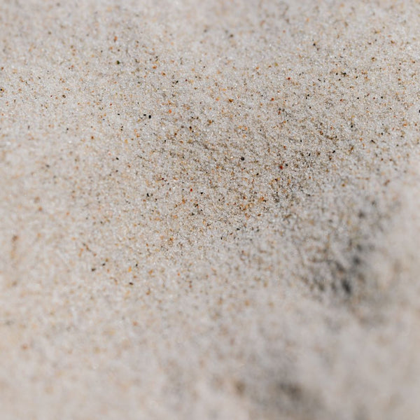 Close-up of white sand.