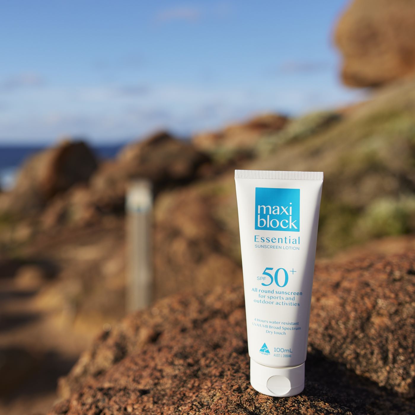 Everyday sunscreen on rocks by the sea