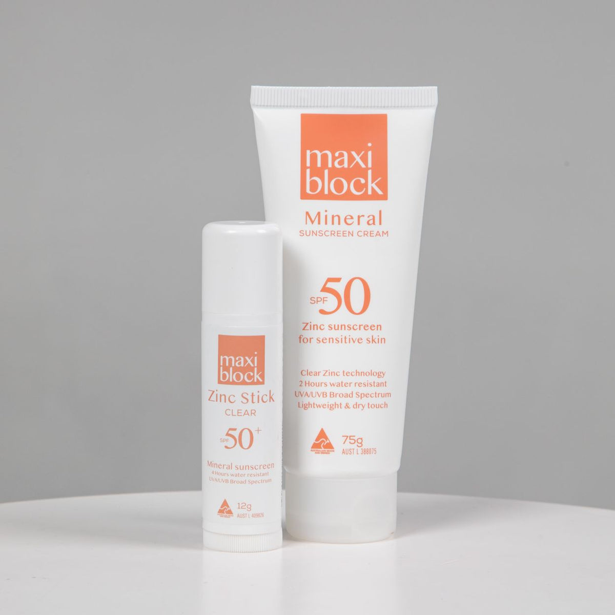 Maxiblock Clear Zinc Stick 12g next to Maxiblock Mineral Sunscreen Cream 75g